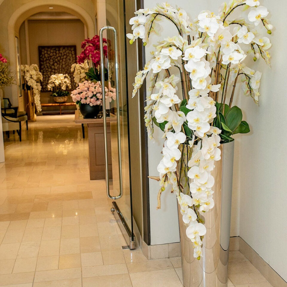 Phalaenopsis Orchids in Cascading Polished Stainless Steel Cone Planter